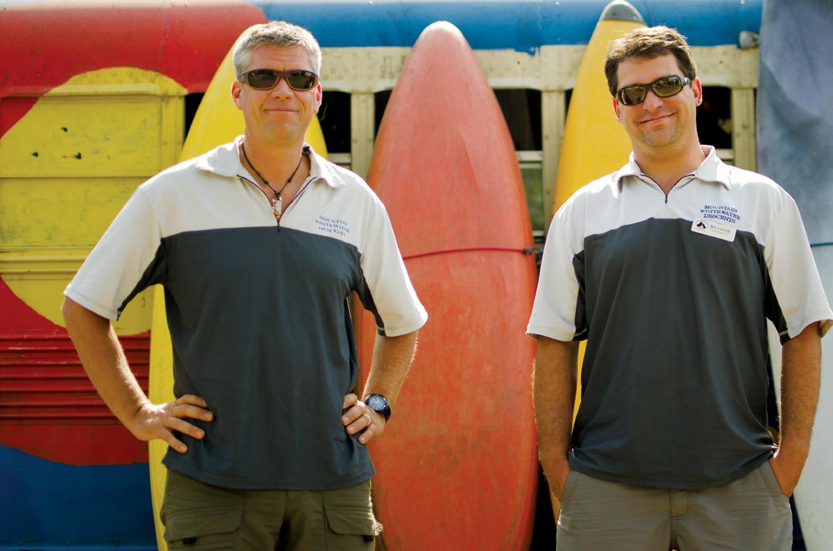 rafting_color_web Brad Mosesitt, owner of Mountain Whitewater Descents, and Ben Costello, manager, stand in front of kayaks on their business' property. Mountain Whitewater Descents has had to close for the first time in its 12 year history due to the Hewlett Gulch and High Park Fires.